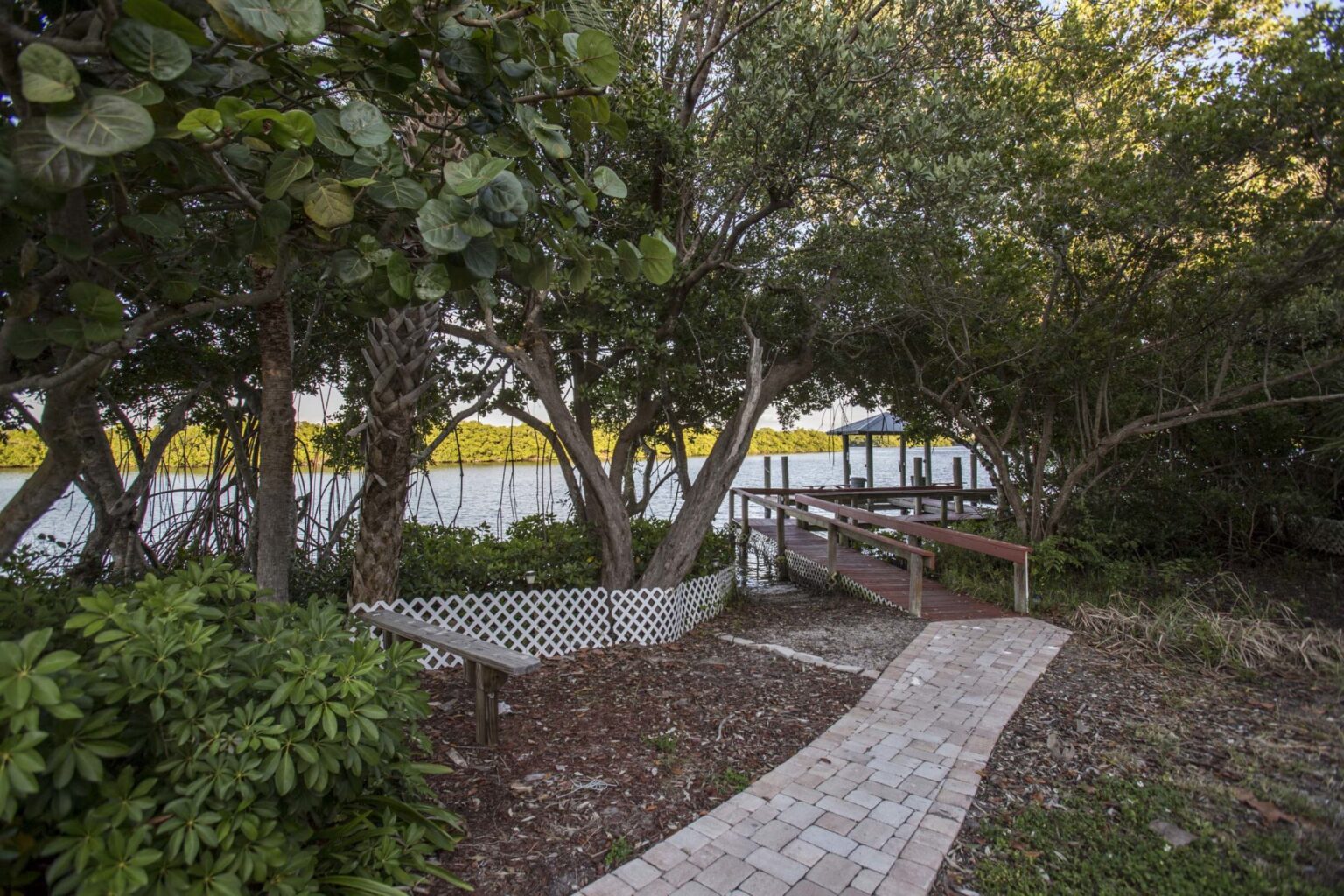 path leading to intracoastal with small boathouse at the end