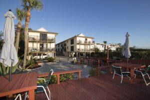 two story Sunburst Condominiums building with deck in foreground