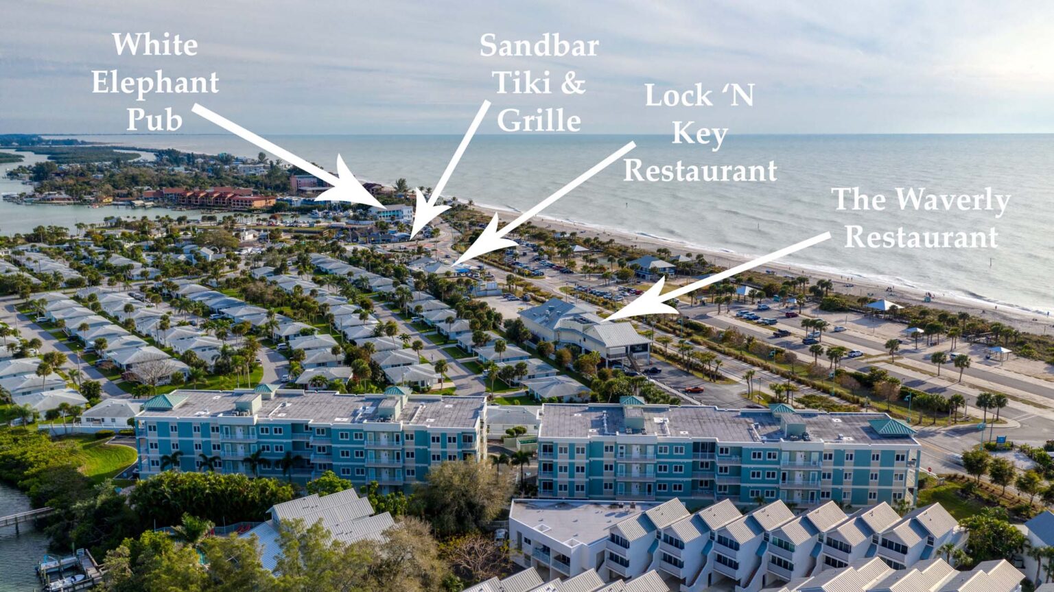 aerial showing proximity of Sunrise Pointe to The Waverly Restaurant, Lock 'N Key Restaurant, Sandbar Tiki & Grille, While Elephant Pub