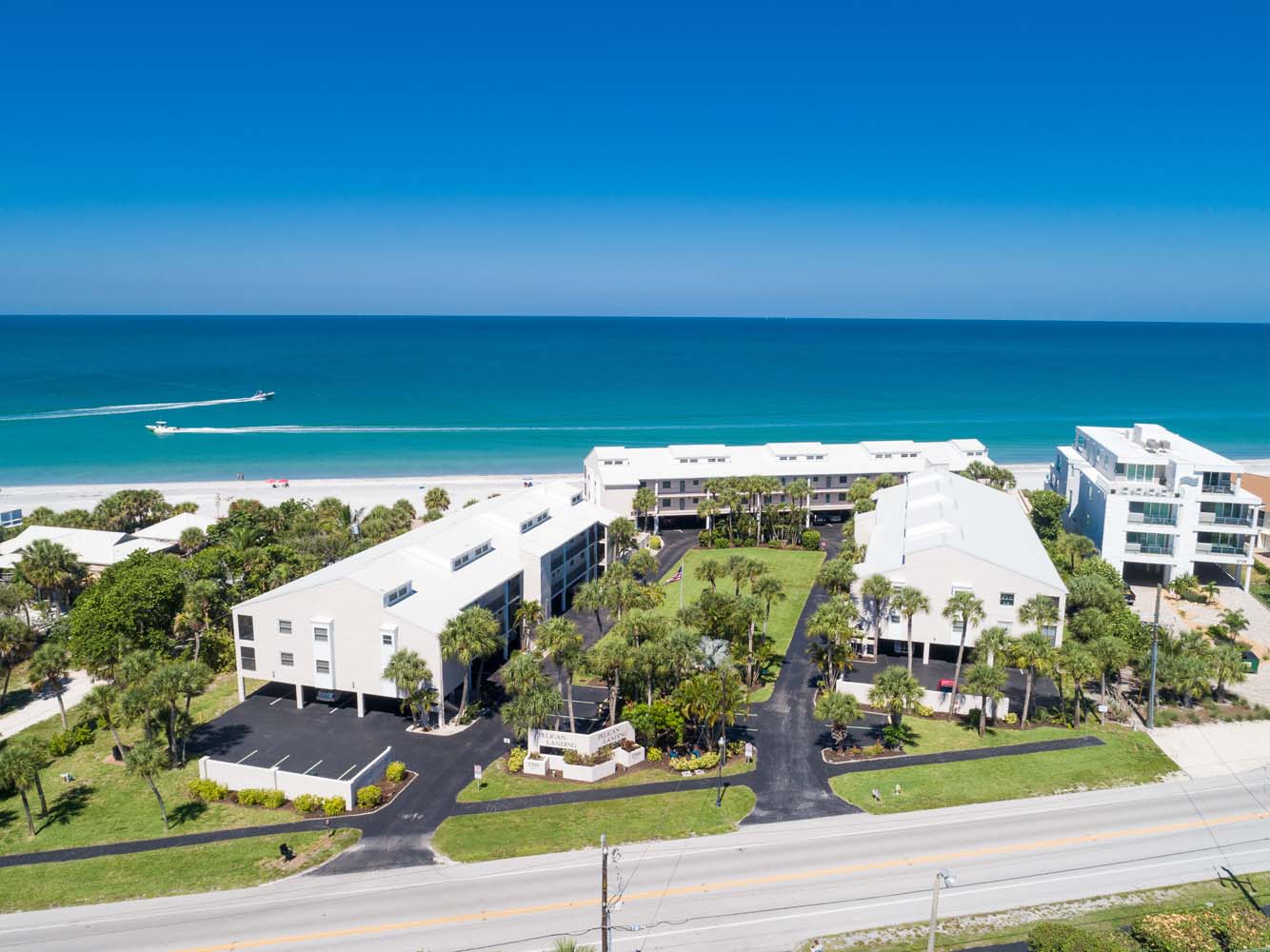 aerial view of Pelican Landing with beach & ocean in background