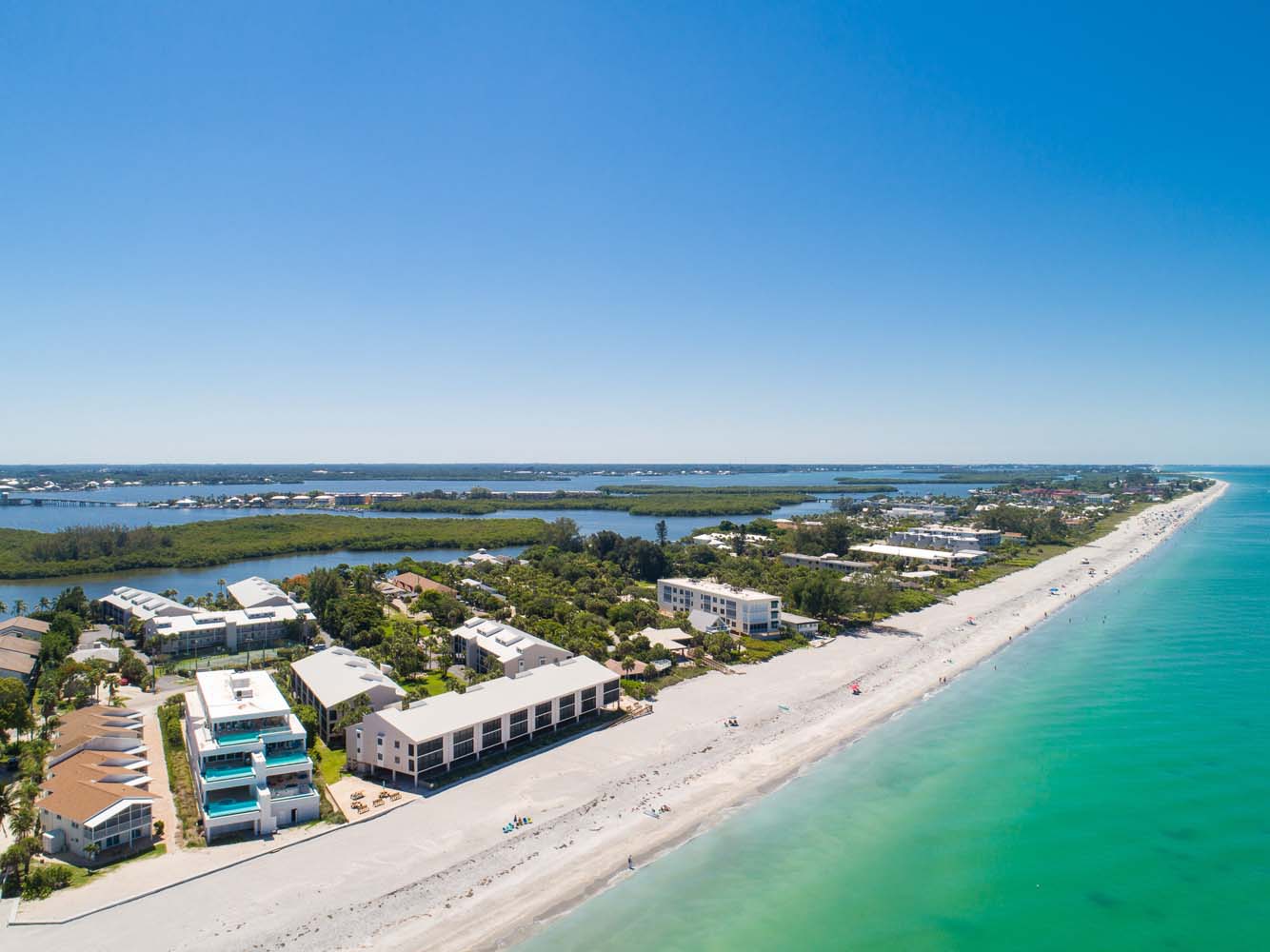 aerial view of Pelican Landing showing near endless beach