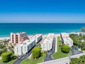 aerial view of La Coquina condo buildings with beach in background