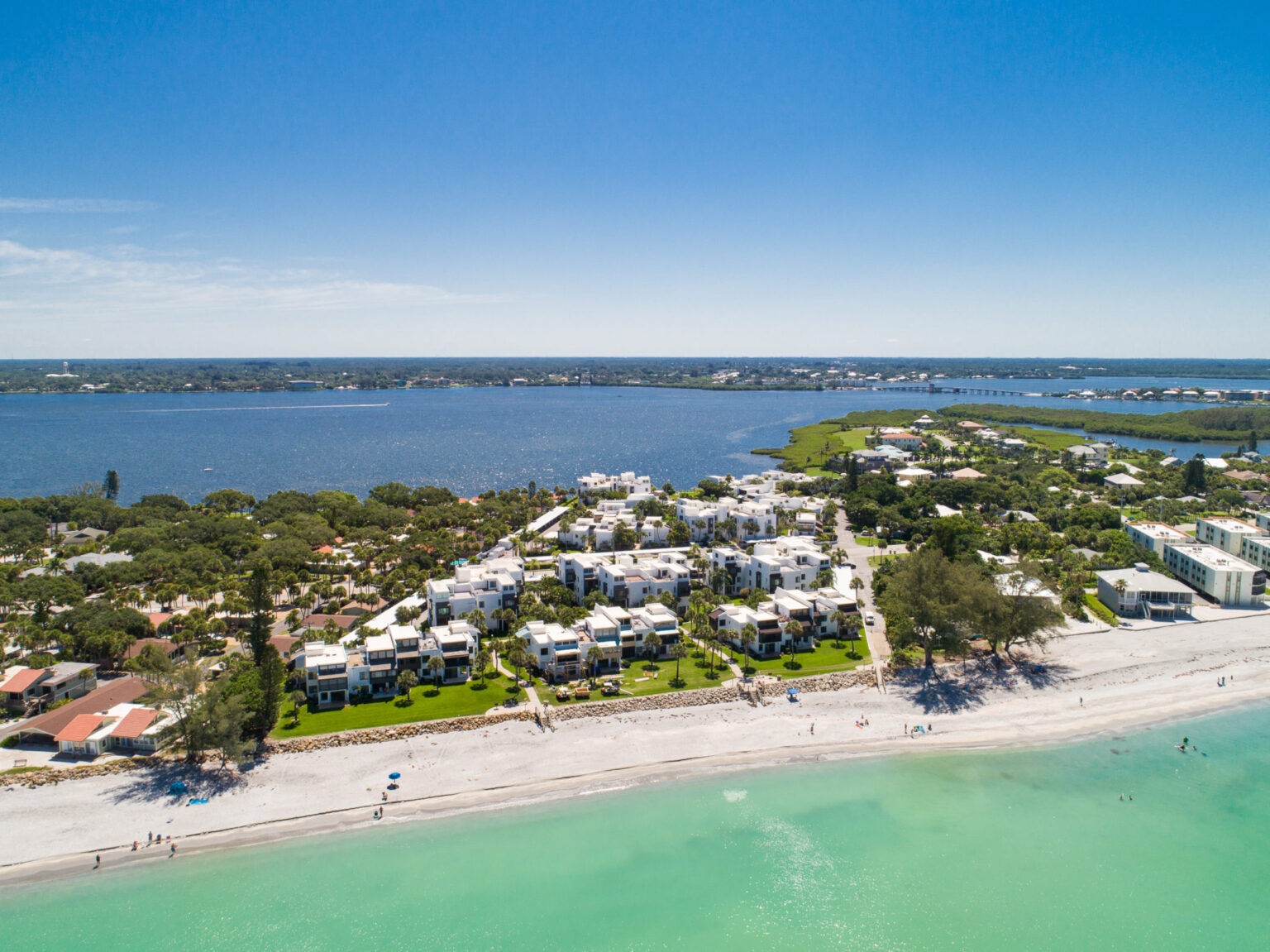 aerial looking from the ocean toward Tamarind Gulf condo buildings