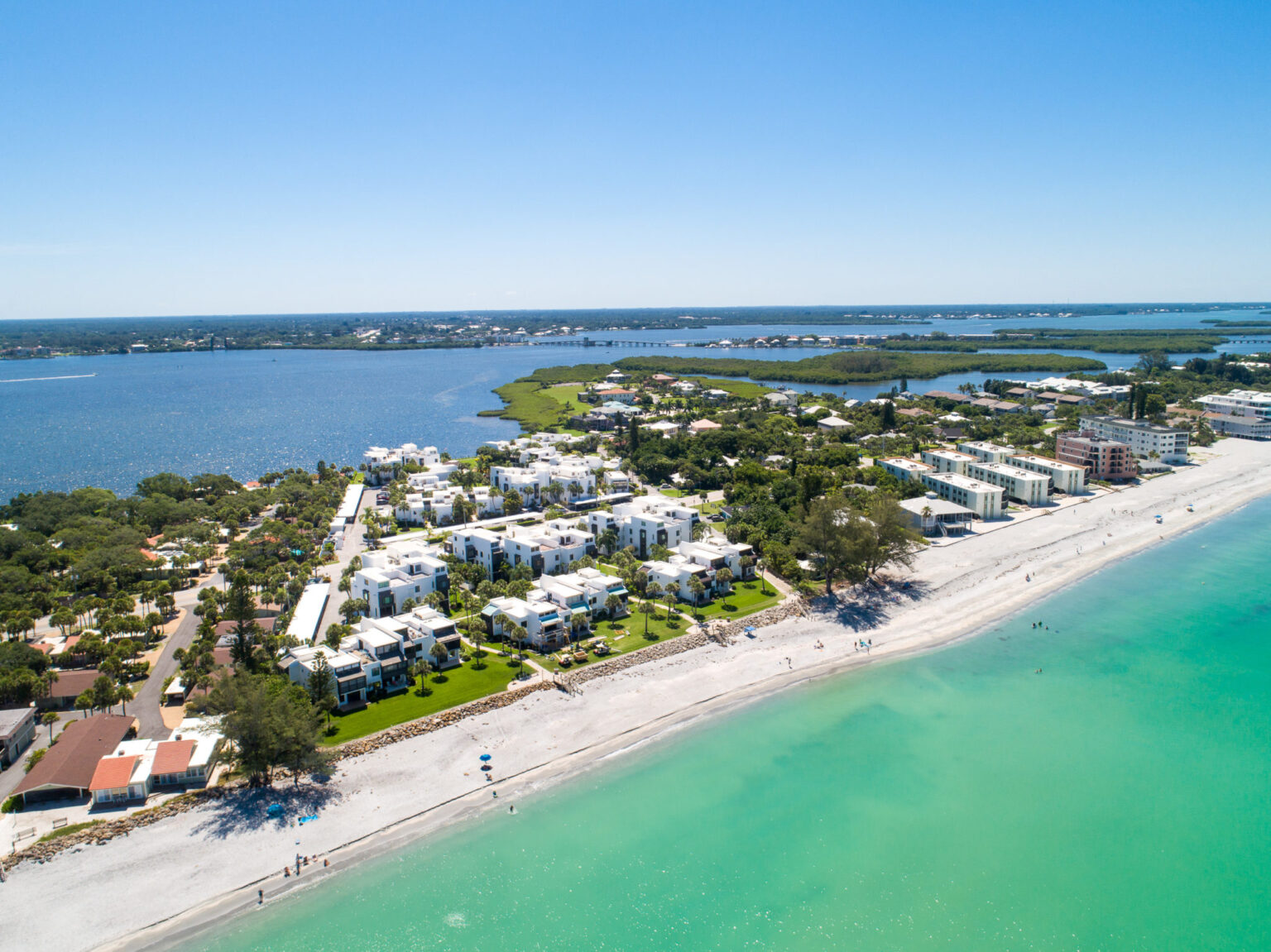 aerial looking from the ocean toward Tamarind Gulf condo buildings