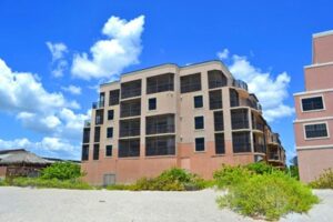 back of multi-story Barefoot Beach building
