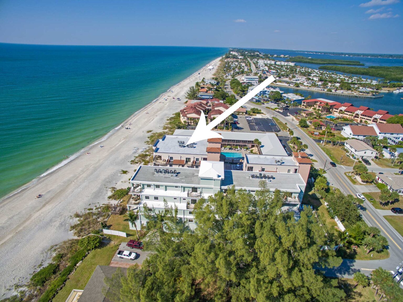 aerial showing Barefoot Beach condo right next to beach