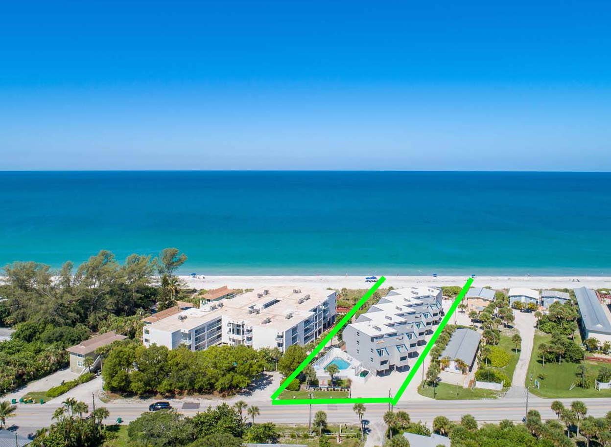 Aerial view of Boardwalk Condominiums with ocean in background