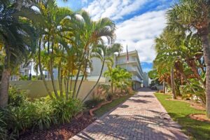 brick path leading to condominium building