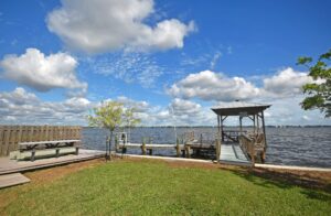 Spinnaker Bay Condos backyard overlooking bay with small pier