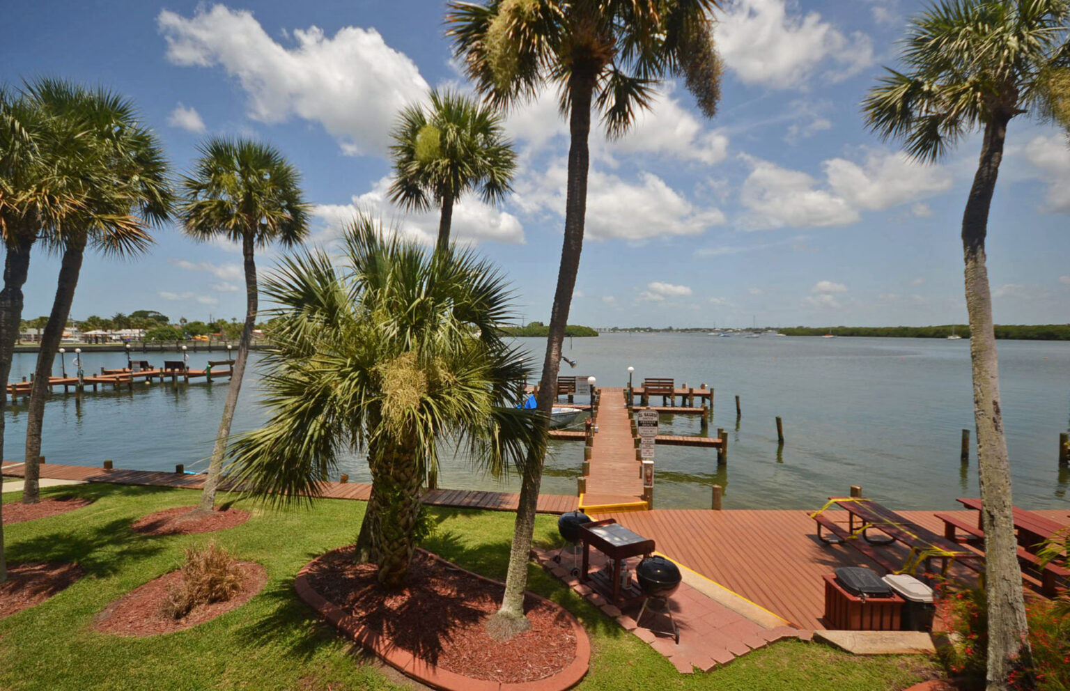 back yard with boat dock, grills and picnic table