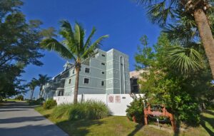 road leading to multi story palms condominiums building