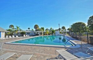 large pool with about a dozen recliners visible