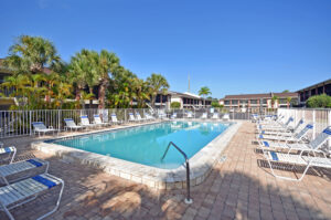 pool with recliners around it