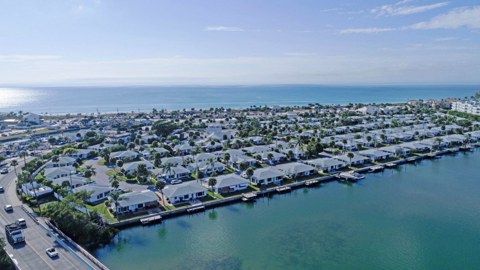 aerial look at Englewood Beach Villas from Intracoastal with beach in the background