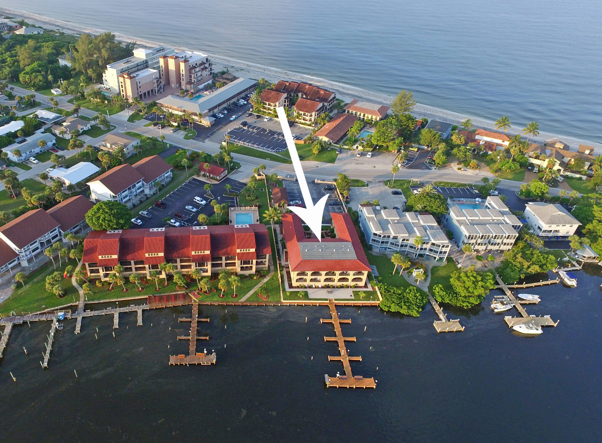 aerial view of el galeon east condo complex located right next to intracoastal with boat dock