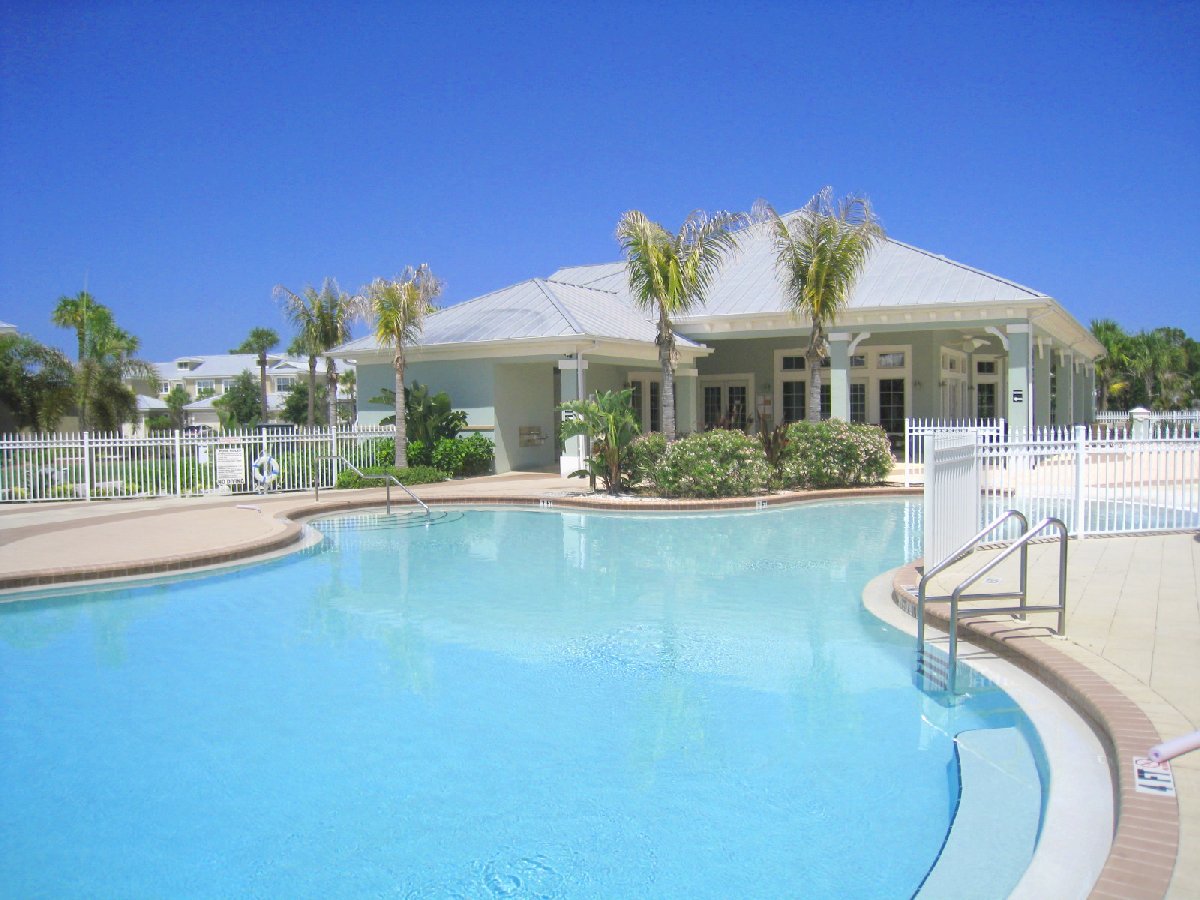 community pool and clubhouse in the background