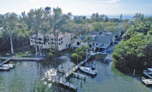 aerial view of Oakwater Cove building with intracoastal boat dock, located on Manasota Key