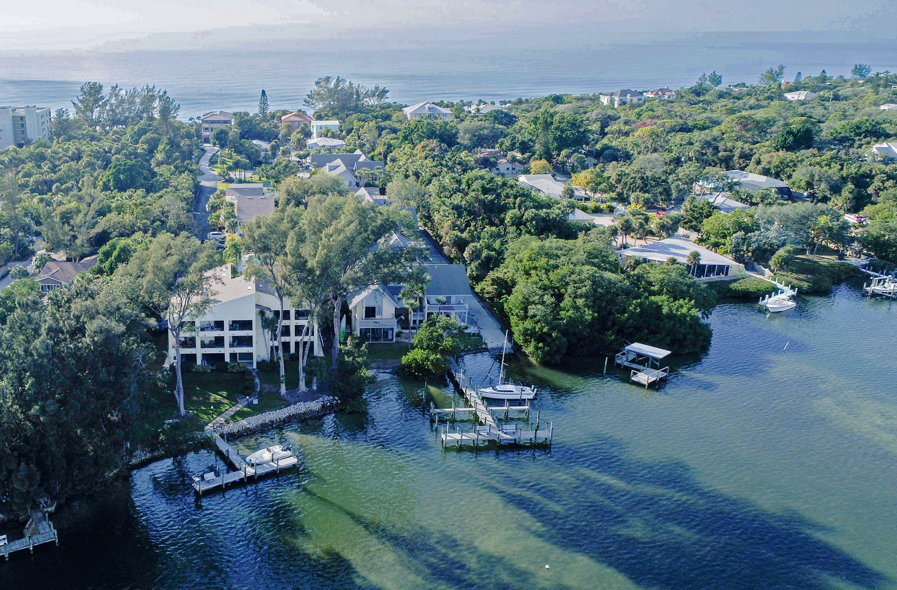 aerial view of Oakwater Cove building with intracoastal boat dock, located on Manasota Key