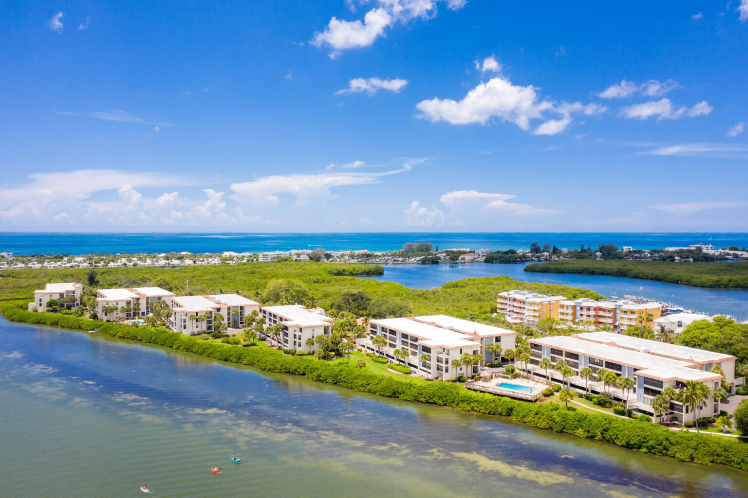 aerial view showing six condo buildings next to one another along the Intracoastal