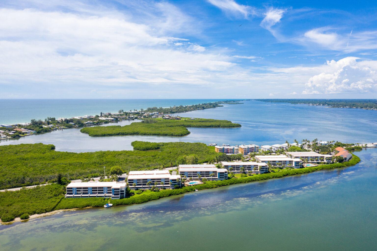 aerial view showing six Sandpiper Key condo buildings next to one another along the Intracoastal