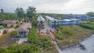 aerial of Sunburst Condominiums buildings looking at it from beach