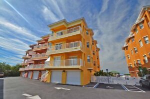 Harbourview Condominiums 3 story building with garages on ground level