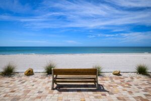 single bench overlooking beach