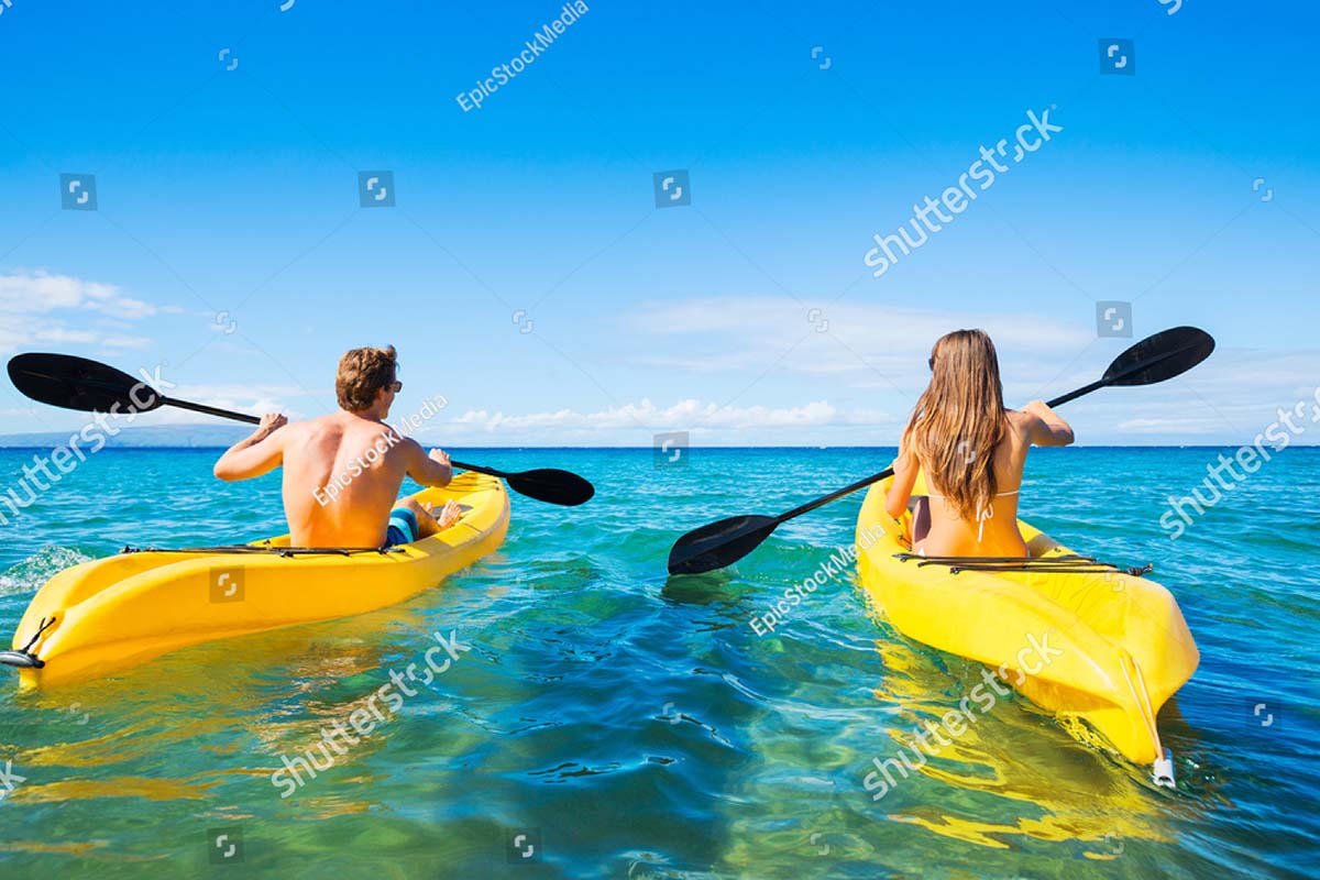 couple kayaking in the ocean